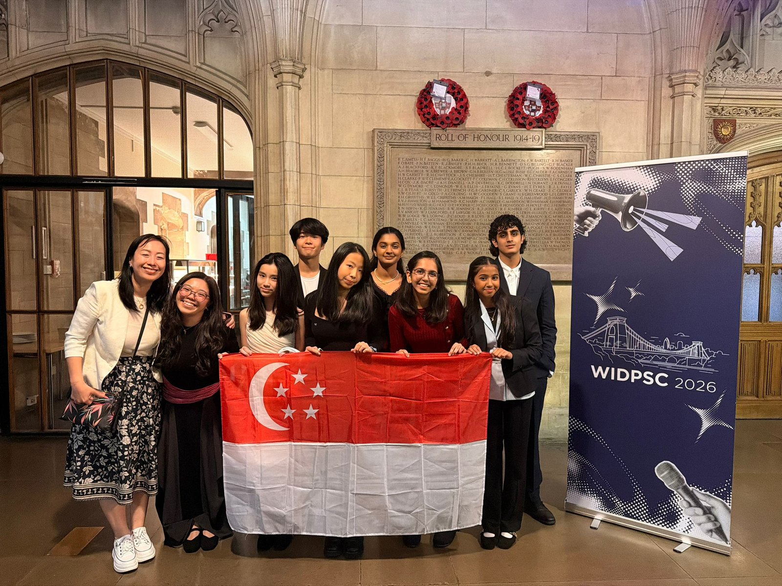 Team Singapore with WIDPSC banner